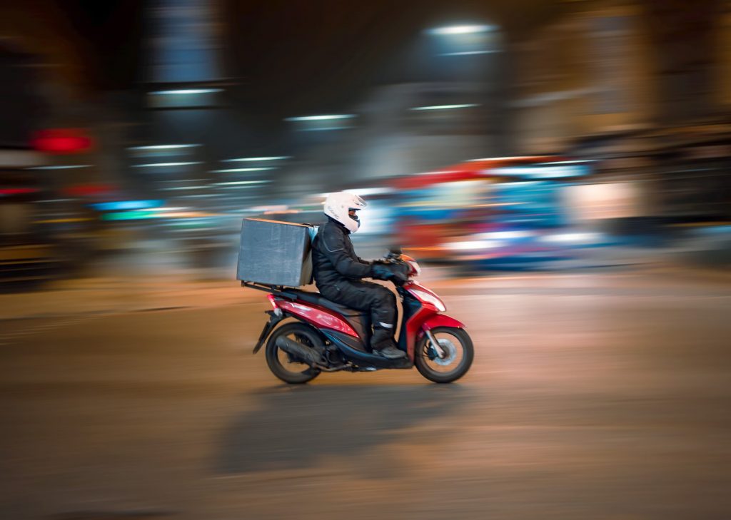 delivery driver on moped