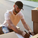 delivery driver making notes