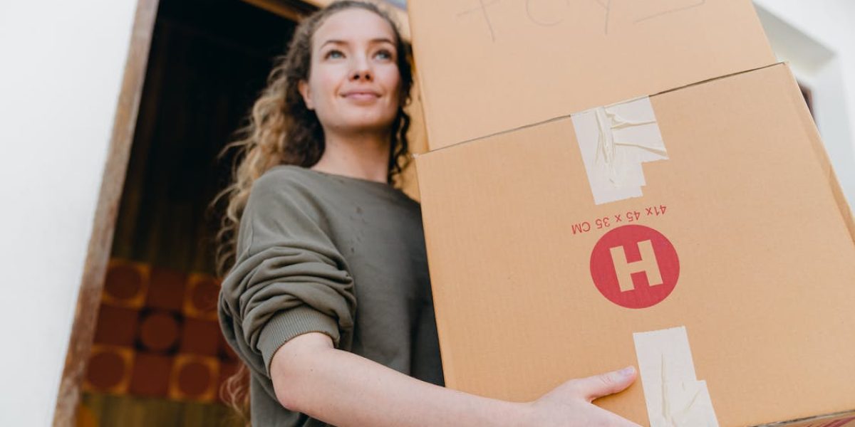 lady carrying storage boxes