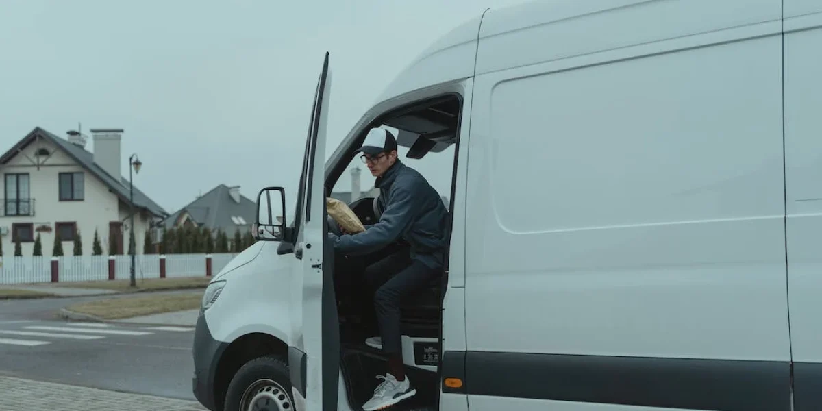 Delivery driver getting out of vehicle