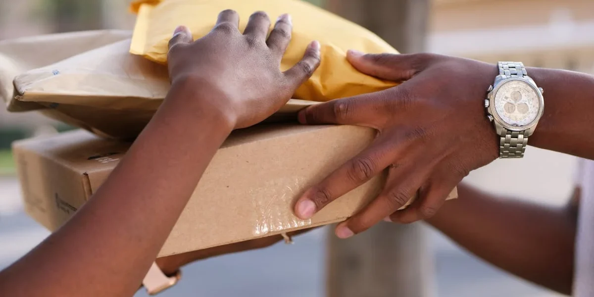 delivery driver handing over packages to recipient
