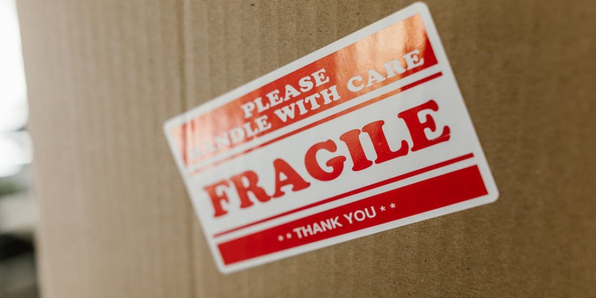 cardboard box with fragile sticker on it