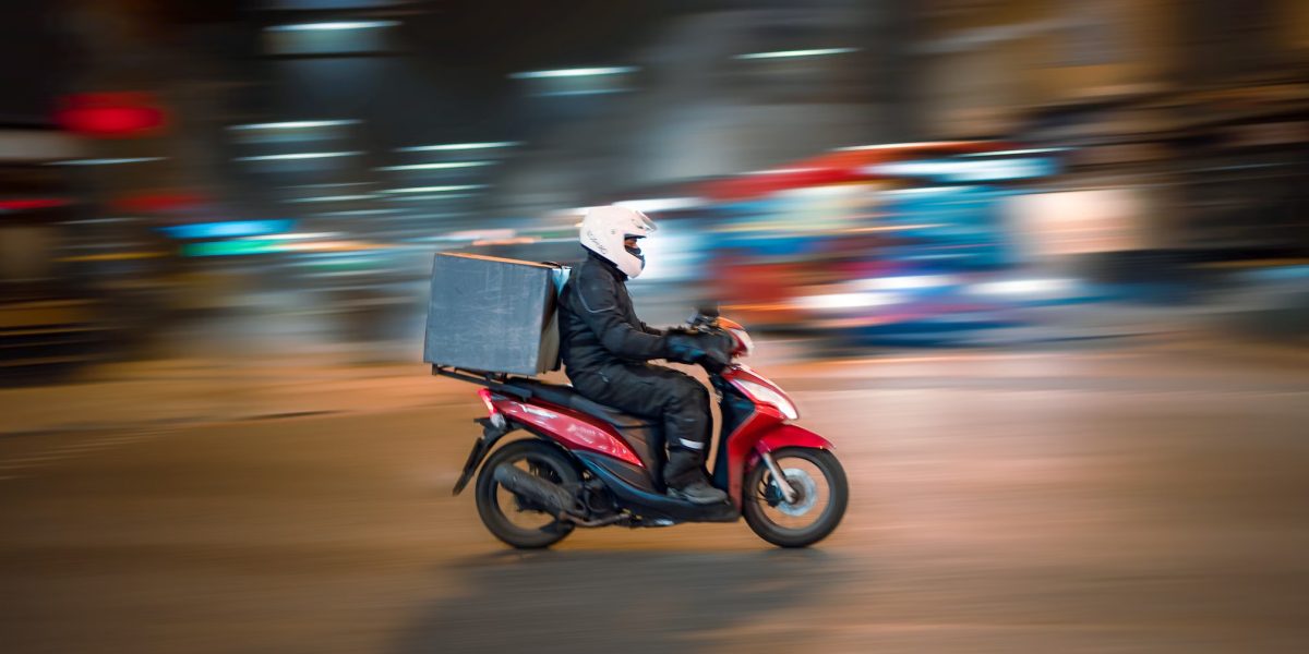 delivery driver on moped